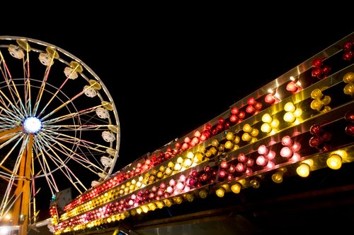 Night shot of Ferris wheel and amusement park lights at Indiana State Fair